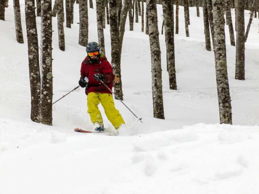 A woman skiing which is a very common winter activity in Maine