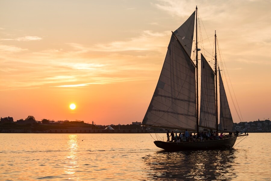 A sunset cruise on the water in Portland, ME during the fall