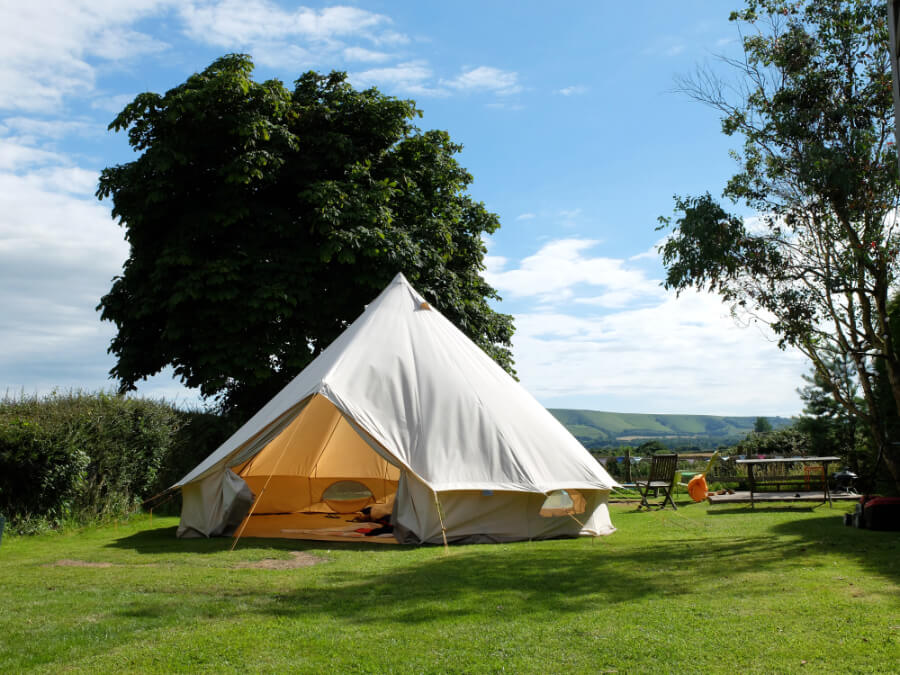 A bell tent which is considered one of the many glamping essentials
