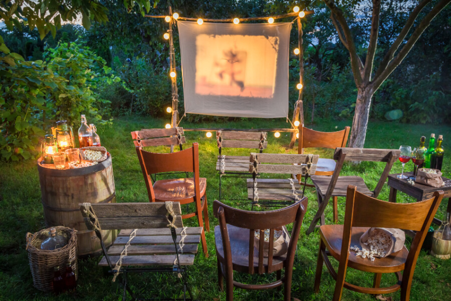 A movie projector and screen for outdoor viewing