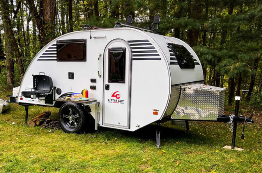 A Little Guy Micro Max camper in the forest