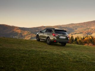 A Subaru Outback after towing a camper trailer