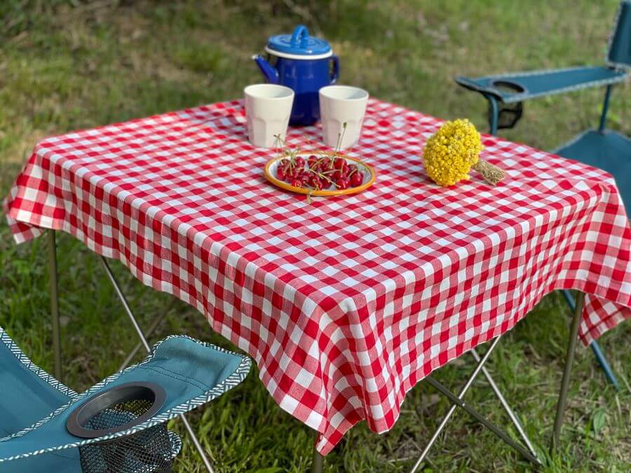 A tablecloth on top of a table at a campsite