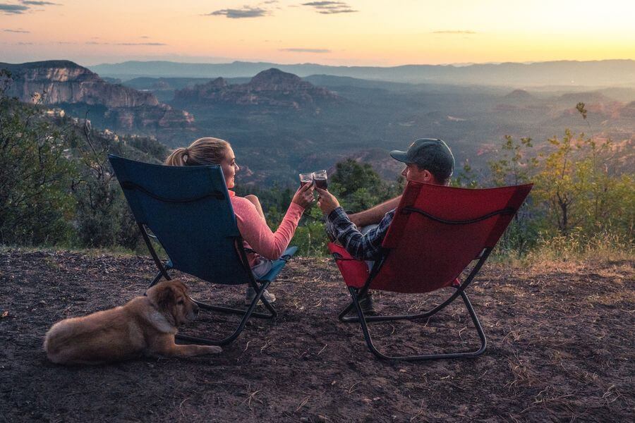 Two campers enjoying the view in their chairs