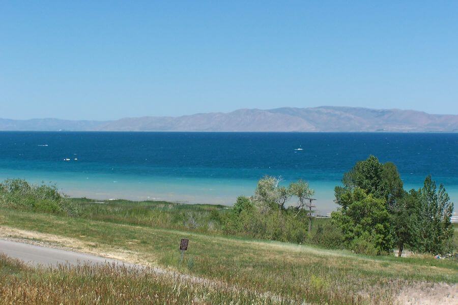 An expansive lake with gradually deeper blue colors the farther away from shore