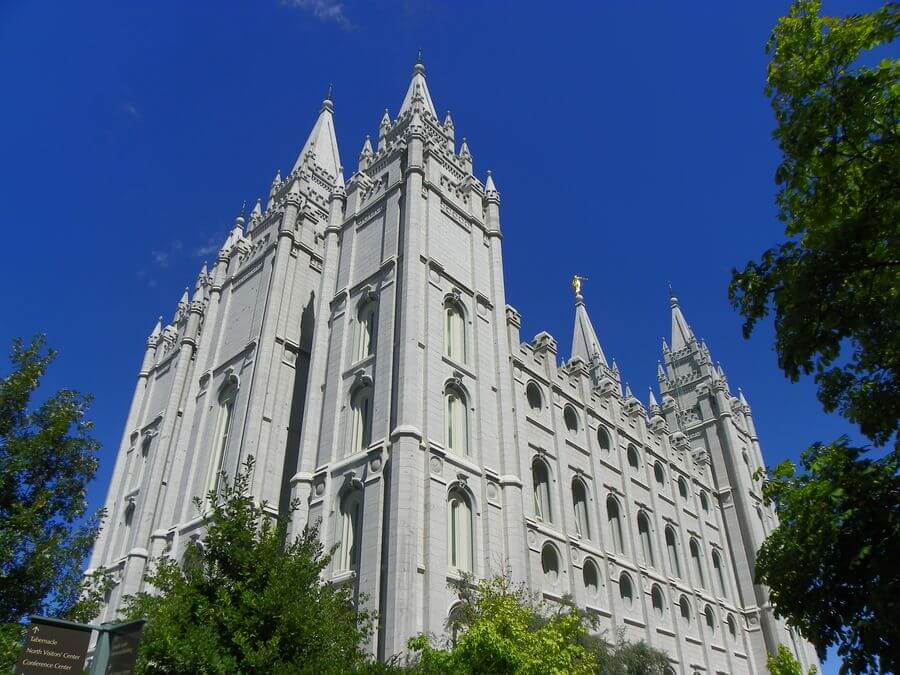 A white ornate church made of quartz against a deep blue sky