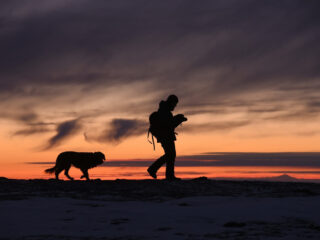 A man walking around after RVing with his dog