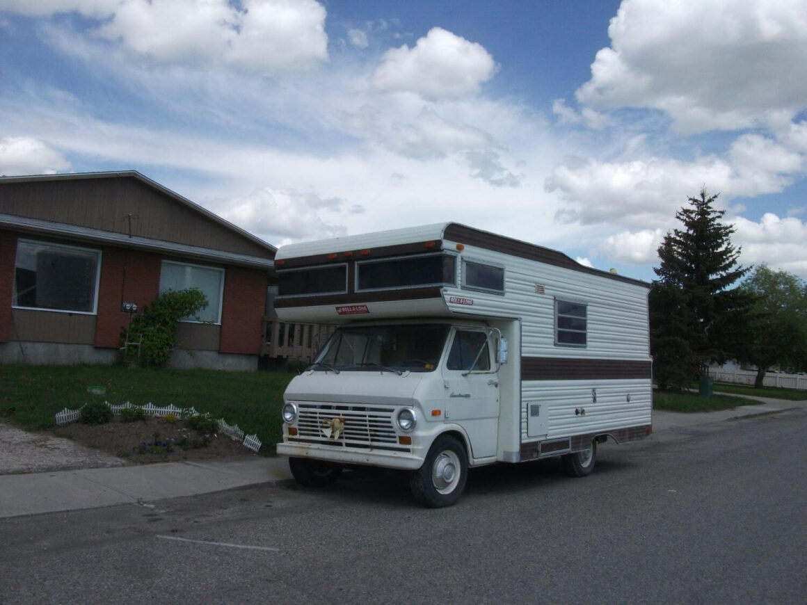 An RV parked for free at the house of a friend