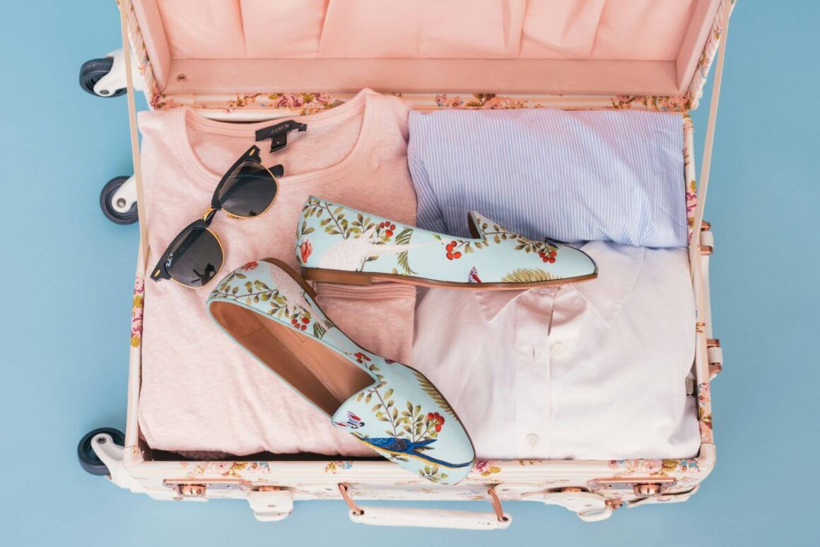 A suitcase full of items from a cruise packing list