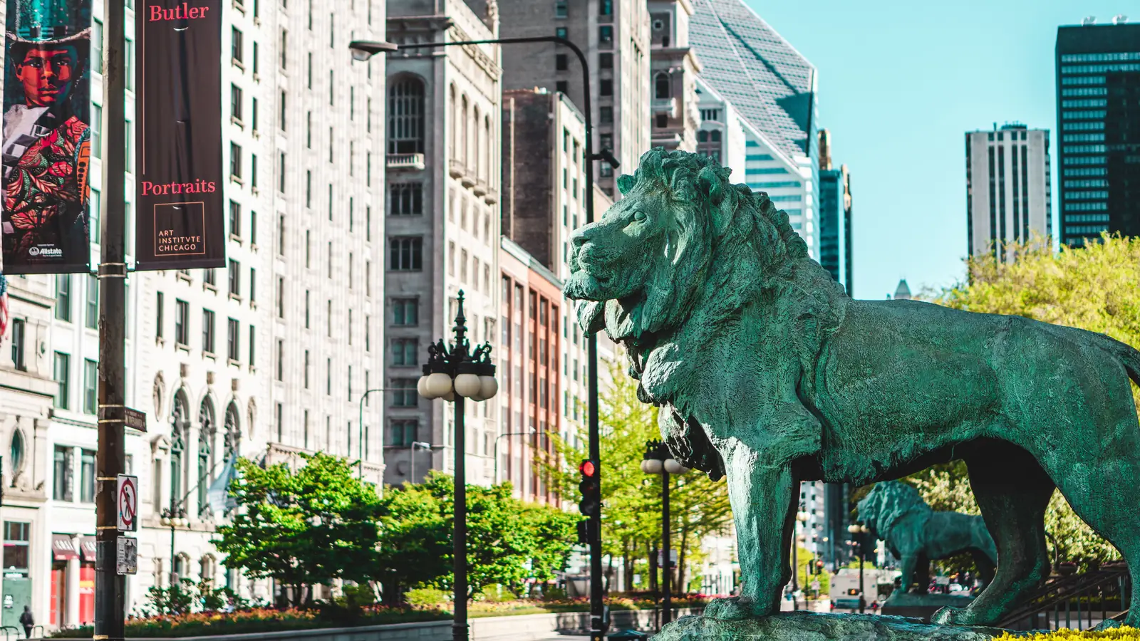The Art Institute of Chicago building with its bronze lion statue out front