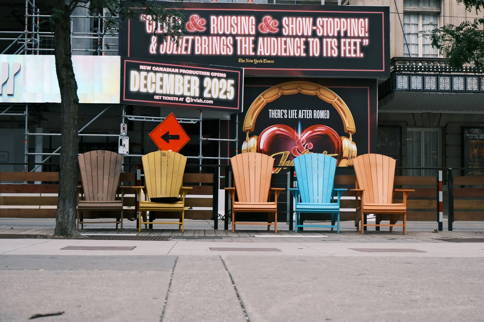 A Broadway show sign on a street in the New York City theater district