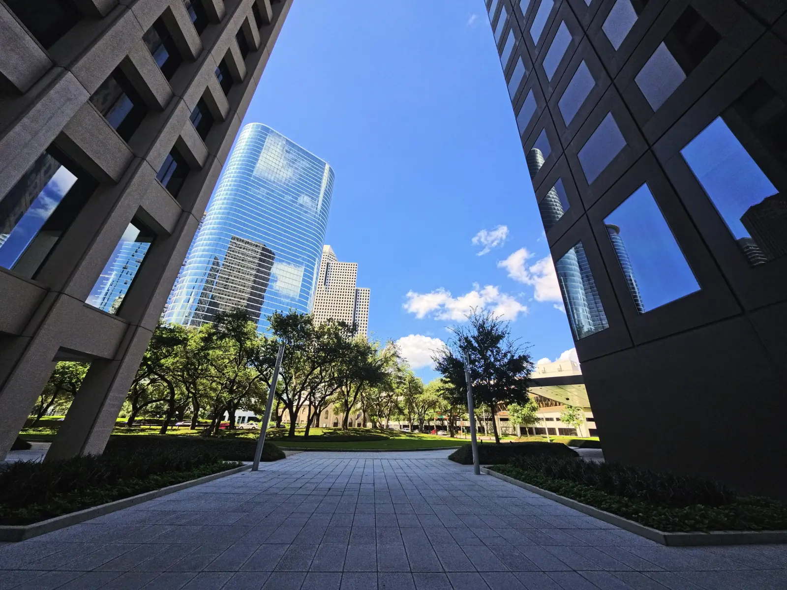Downtown Houston skyscrapers rising above a plaza near Discovery Green