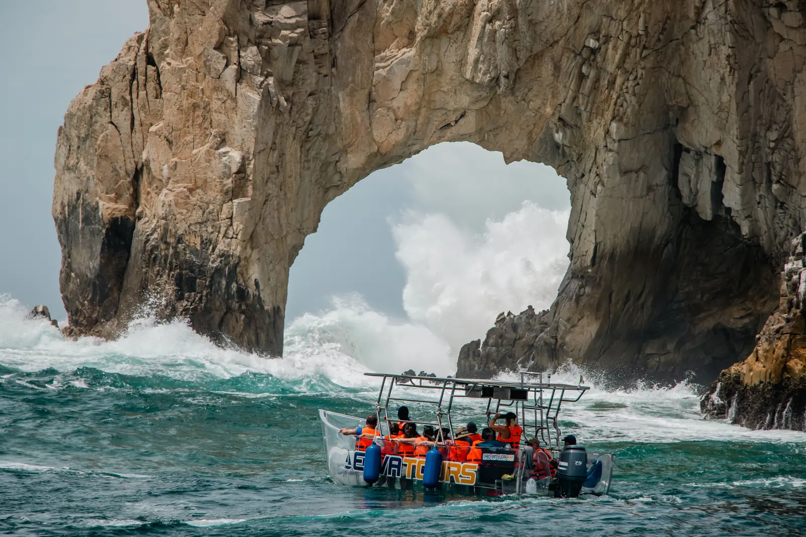 Tourists on a boat at El Arco in Cabo San Lucas, Mexico