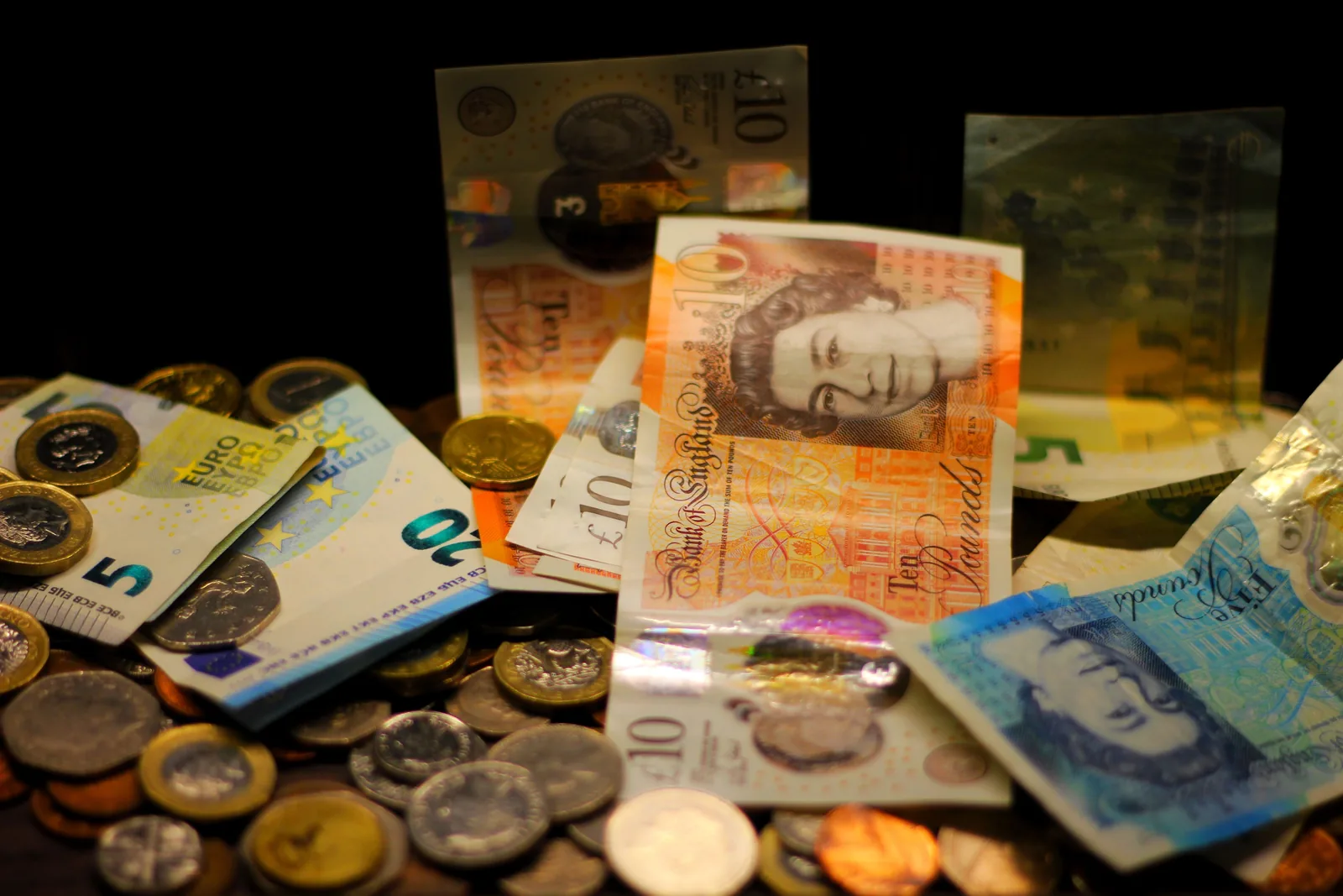 Euro and British pound banknotes spread together