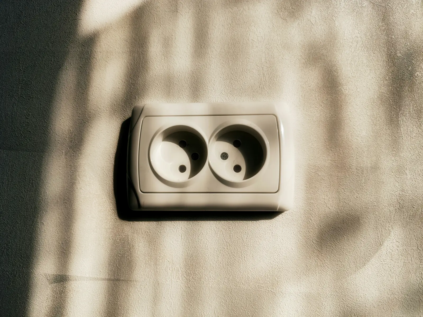 A two round pin European wall socket of the type used across the continent