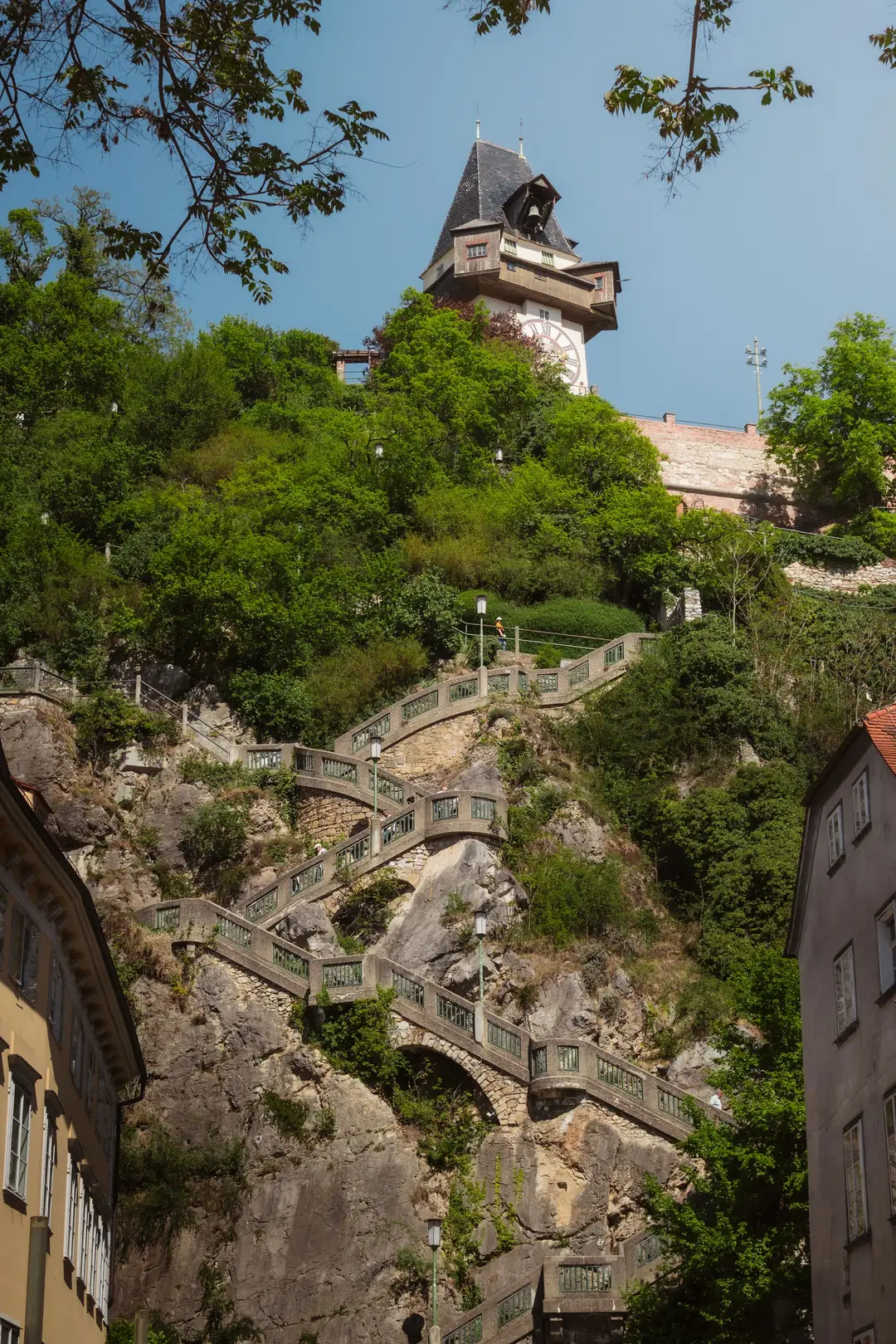 The zigzag stone staircase climbing the cliff of Schlossberg up to the clock tower in Graz