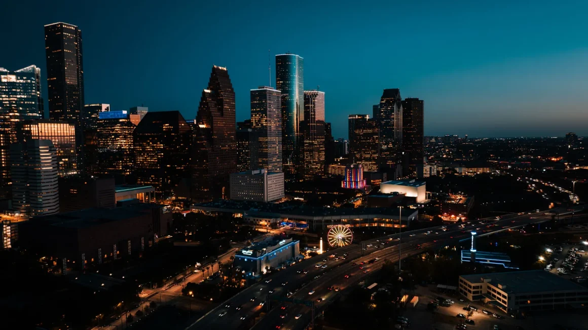 The downtown Houston skyline lit up at dusk