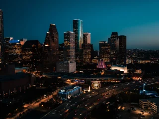 The downtown Houston skyline lit up at dusk