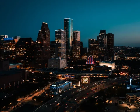 The downtown Houston skyline lit up at dusk