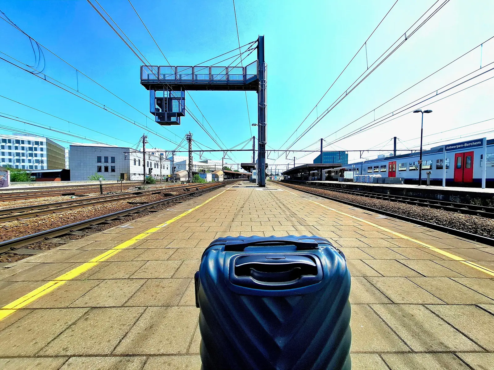 A wheeled suitcase on the platform at Antwerp train station