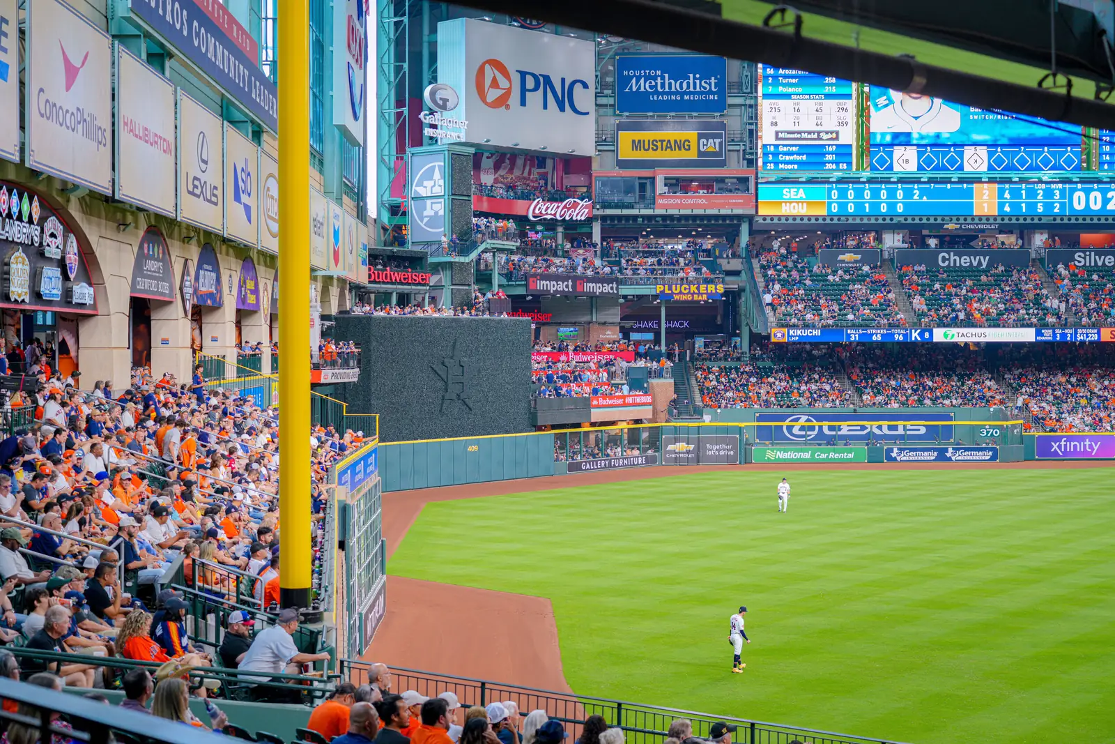 Fans watching an Astros game at Minute Maid Park in Houston