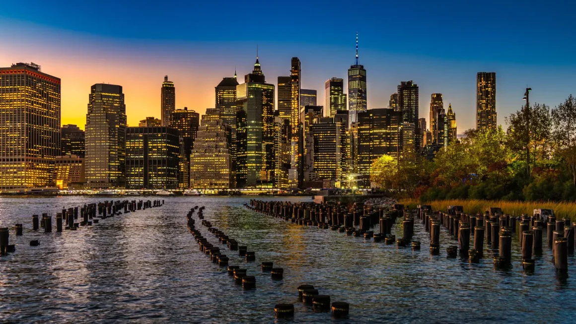 New York City skyline at sunset seen across the water from Brooklyn