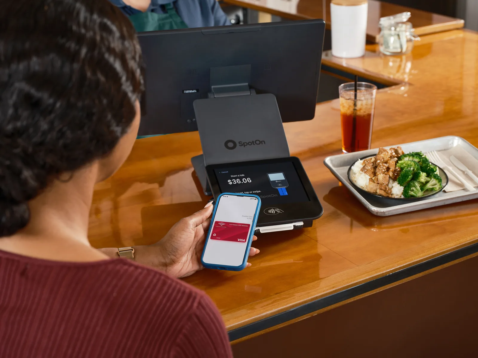 A contactless card payment at a restaurant counter