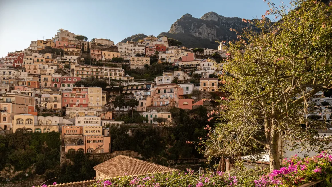 Pastel houses of Positano stacked up the cliffs on the Amalfi Coast