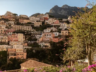 Pastel houses of Positano stacked up the cliffs on the Amalfi Coast