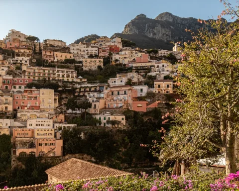 Pastel houses of Positano stacked up the cliffs on the Amalfi Coast
