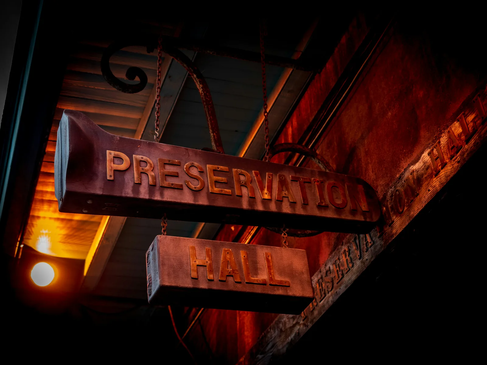 The glowing Preservation Hall sign in the New Orleans French Quarter