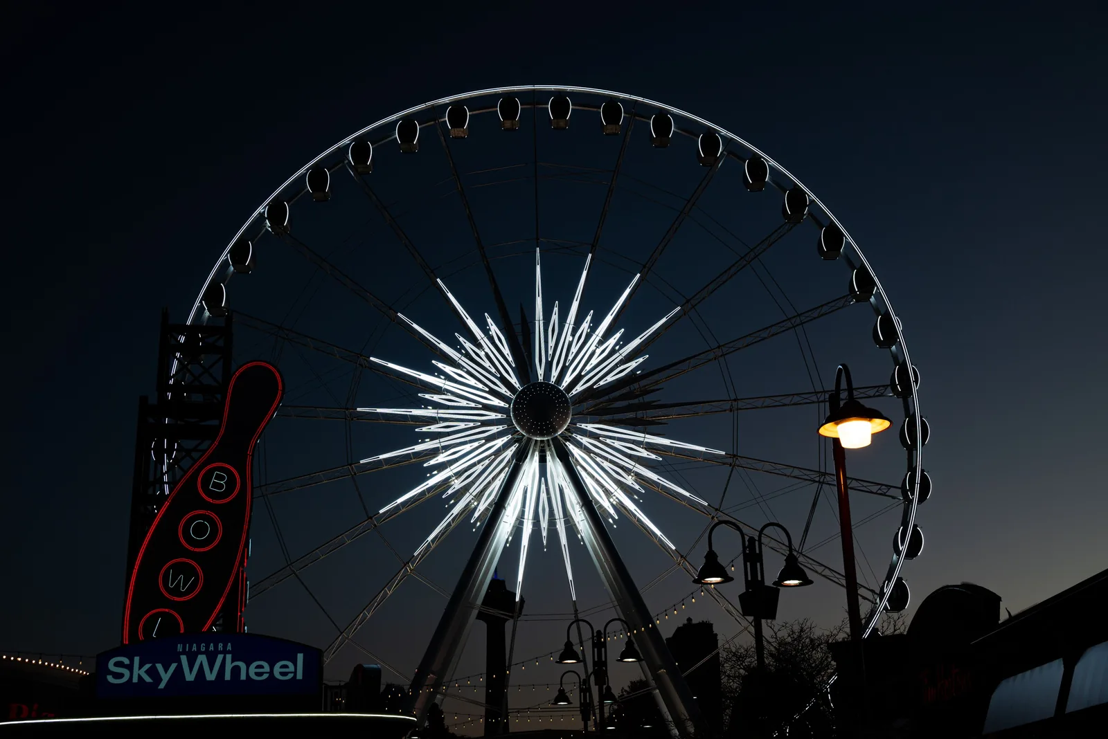 The SkyWheel lit up at night on the Myrtle Beach boardwalk