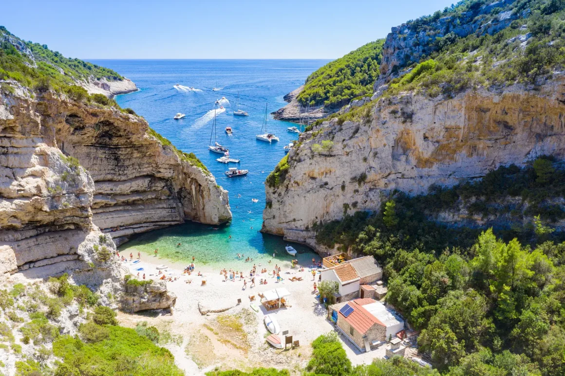 Aerial view of Stiniva cove and its narrow opening to the sea on Vis, Croatia