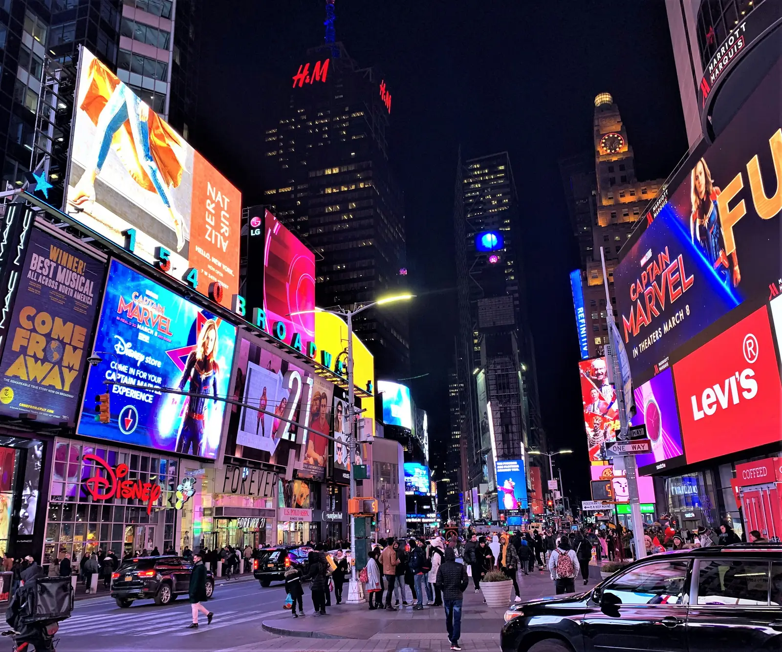 Times Square lit up with billboards at night in New York City