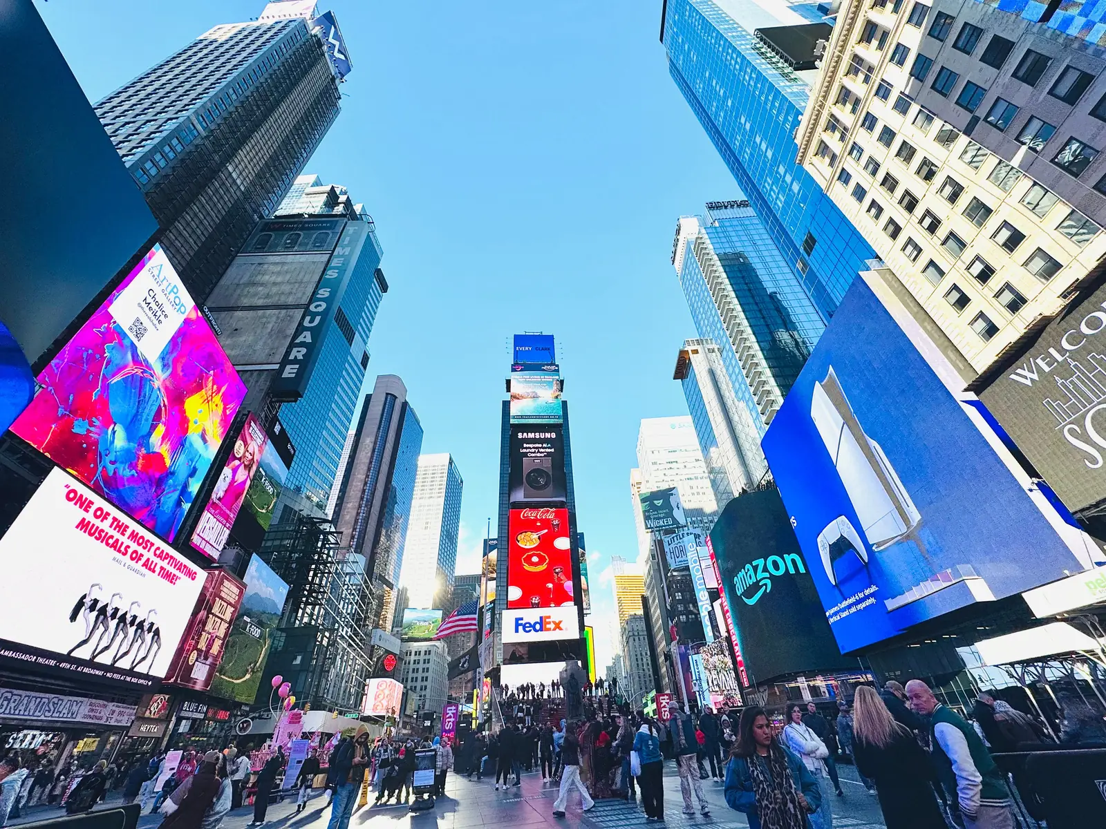 Times Square billboards and crowds in Midtown Manhattan