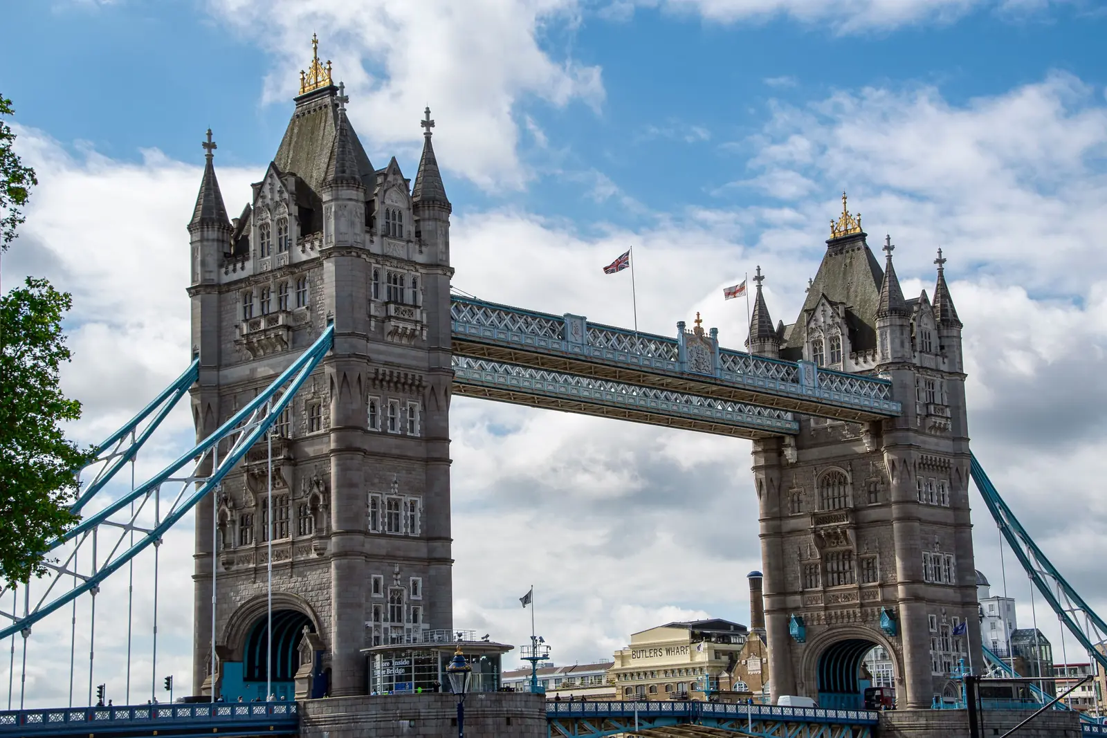 Tower Bridge and its blue suspension cables against a bright sky