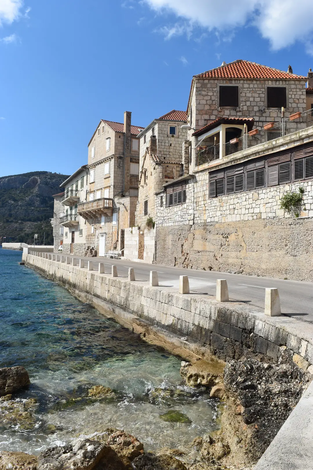 Old stone houses lining the waterfront in Vis Town, Croatia