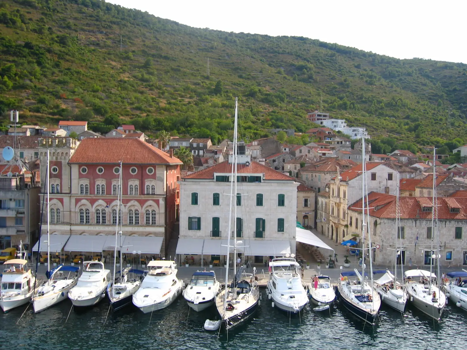 Boats moored along the quay in Vis Town harbor, Croatia