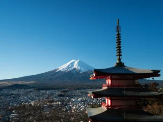 Chureito Pagoda with Mount Fuji rising behind it on a clear morning