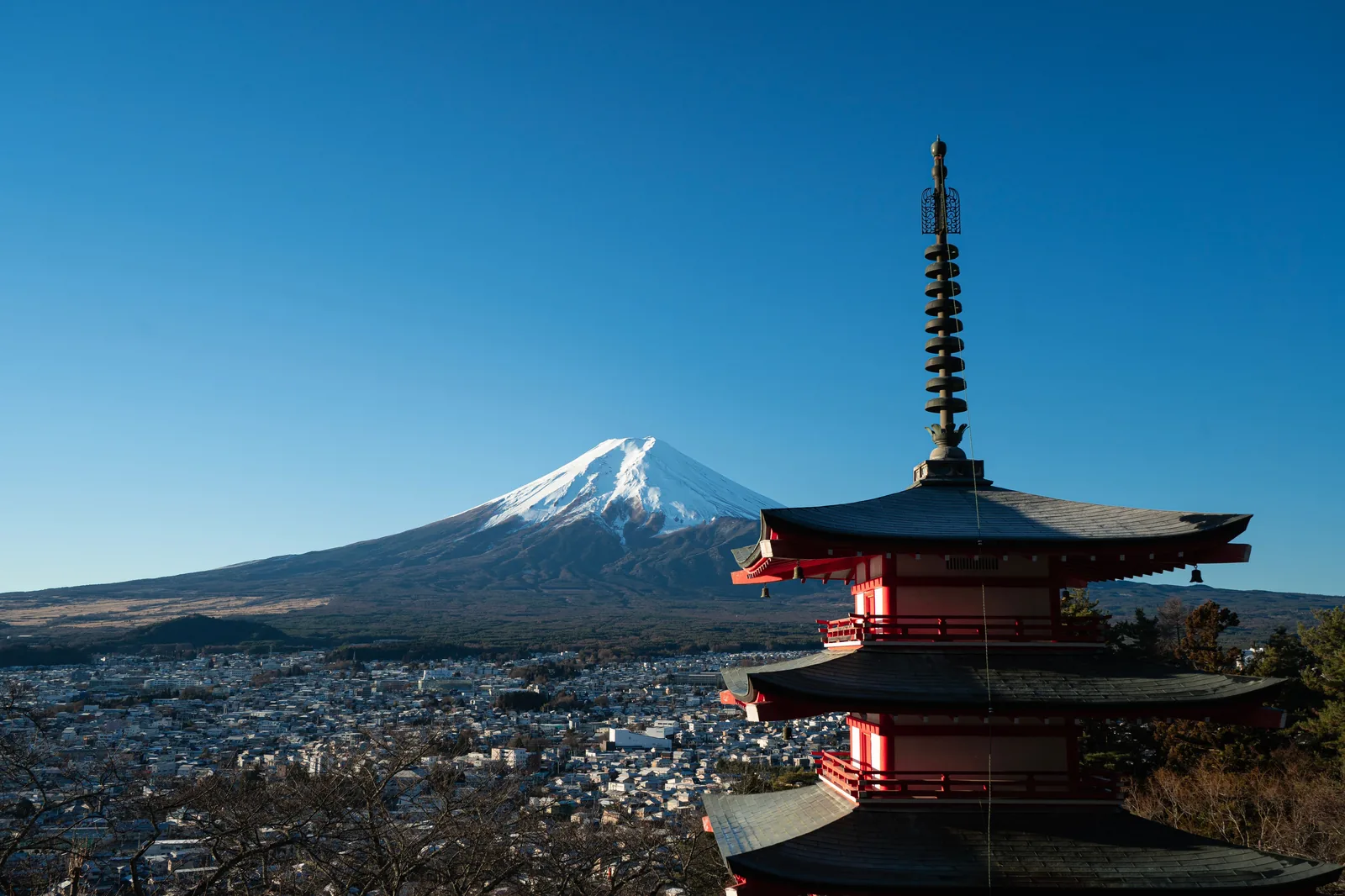 Chureito Pagoda with Mount Fuji rising behind it on a clear morning