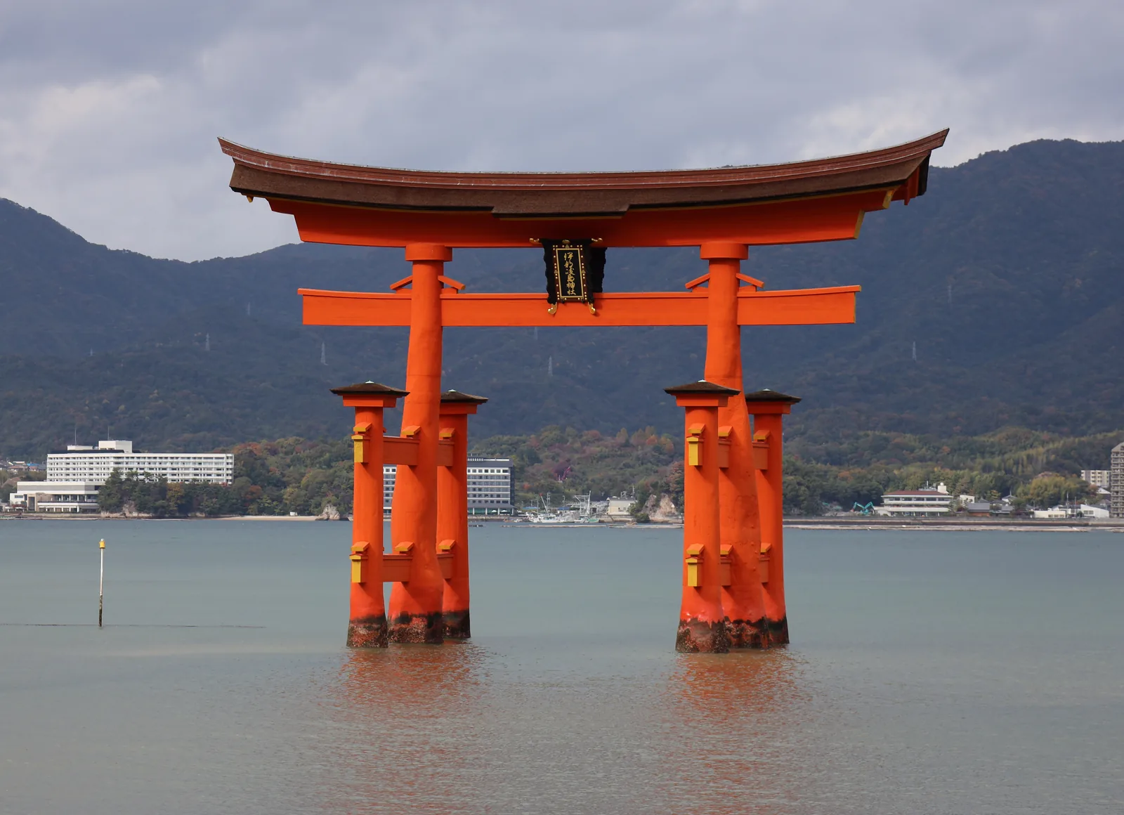 The floating torii gate of Itsukushima Shrine standing in the water at Miyajima