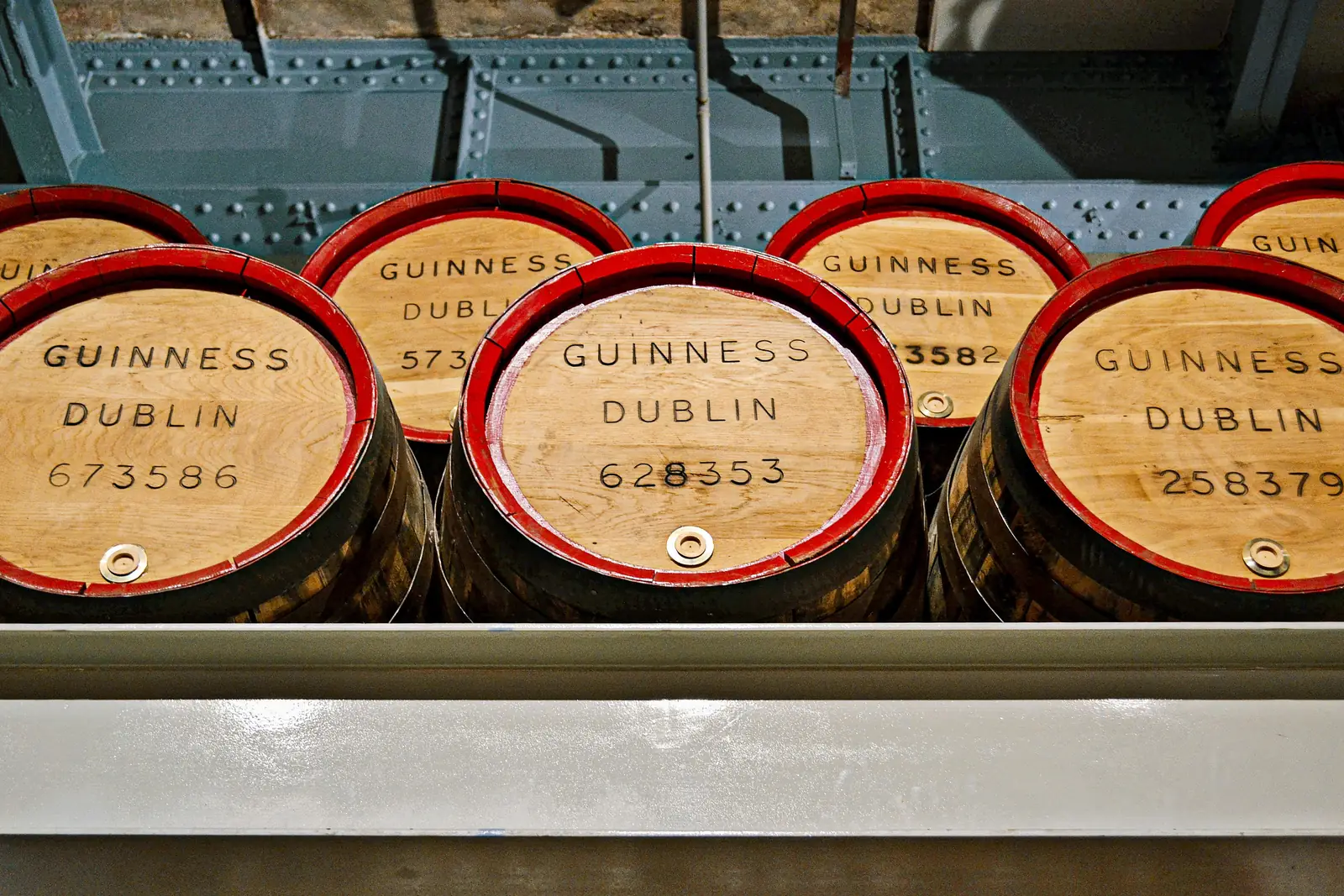 Wooden Guinness barrels stamped with the Dublin brewery mark