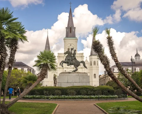 St. Louis Cathedral rising above Jackson Square behind palms in New Orleans
