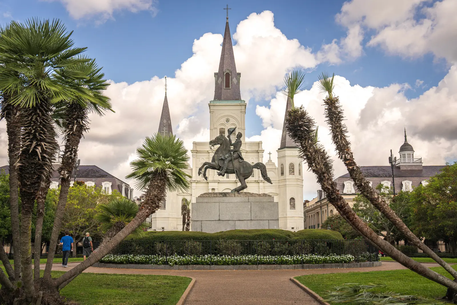 St. Louis Cathedral rising above Jackson Square behind palms in New Orleans