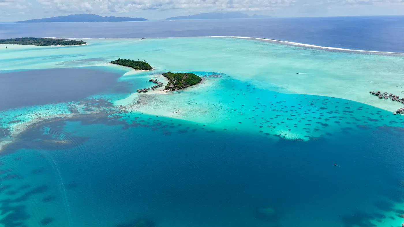 The turquoise lagoon at Bora Bora seen from the air