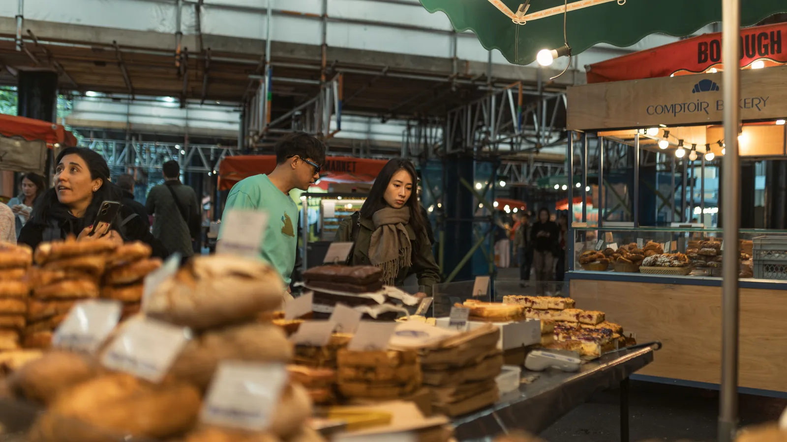 Shoppers at a bread stall in Borough Market in London
