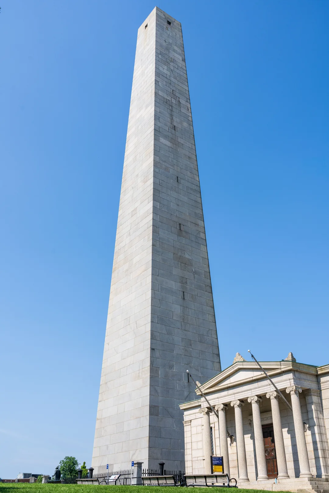 The granite Bunker Hill Monument rising above its lodge in Charlestown Boston