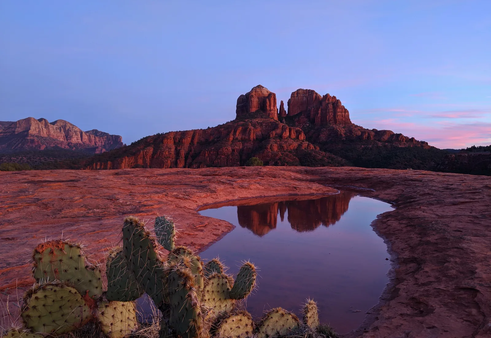 Cathedral Rock standing against a blue sky in Sedona Arizona