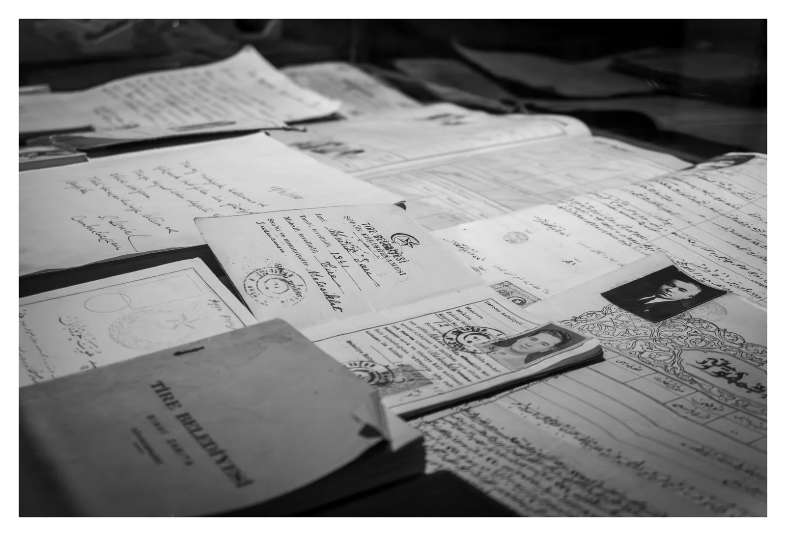 Historical documents and papers laid out in a museum display