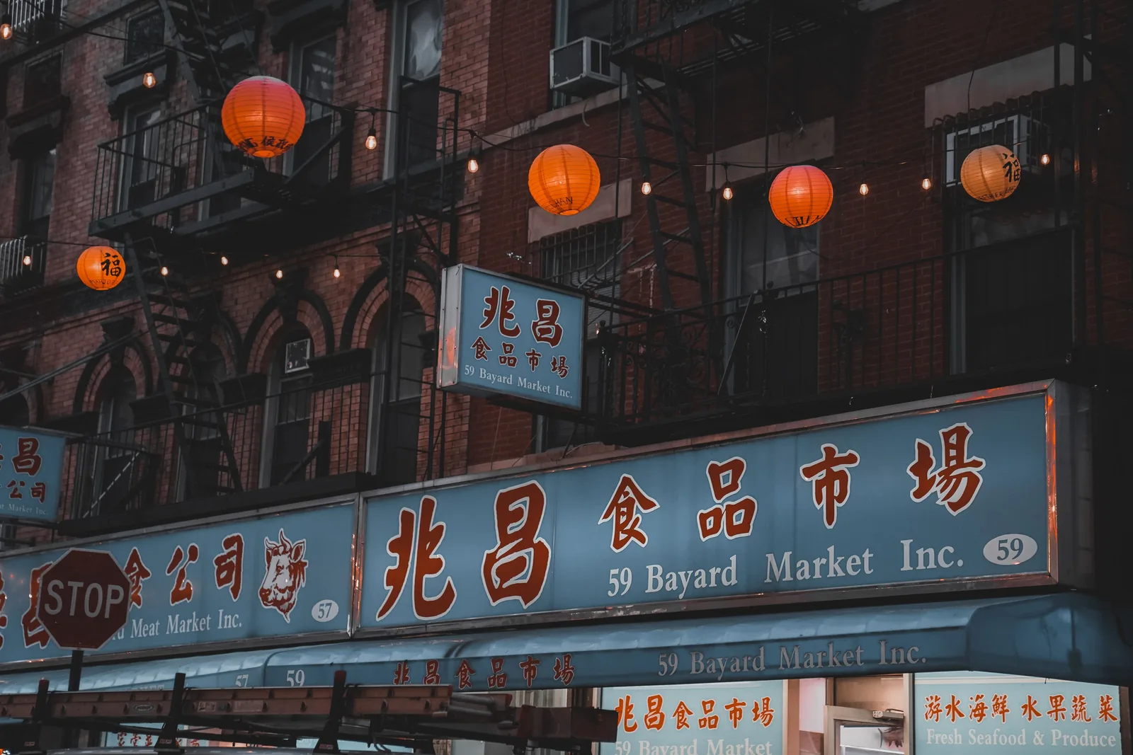 A residential block in Chinatown in New York City lit up at night